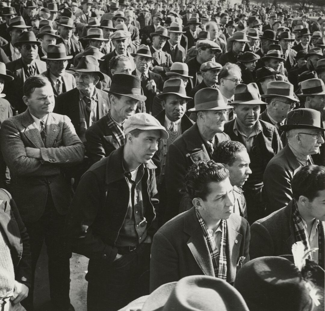 Large conference hall with attentive audience watching a presentation