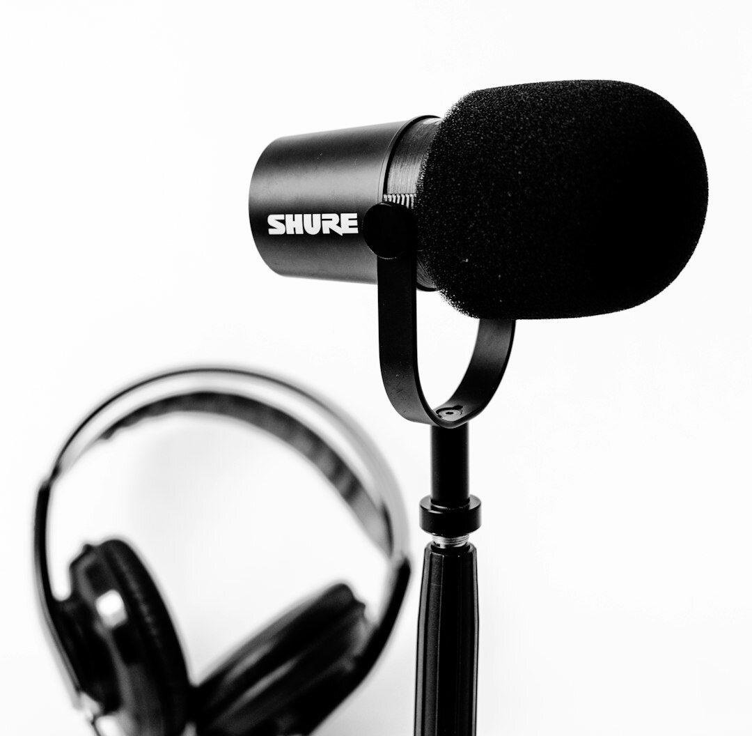 Professional podcast recording session with microphone and headphones